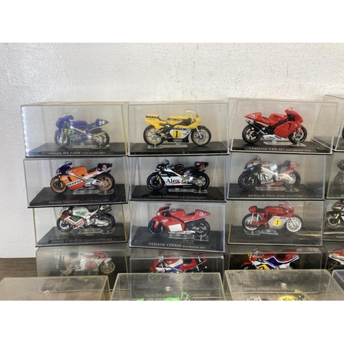 513 - A large collection of boxed motorcycle diecast model vehicles