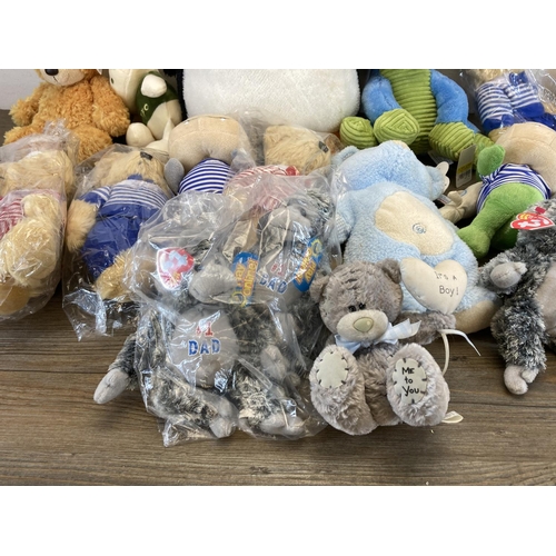 518 - A collection of soft toys to include Ty Beanie Babies etc.