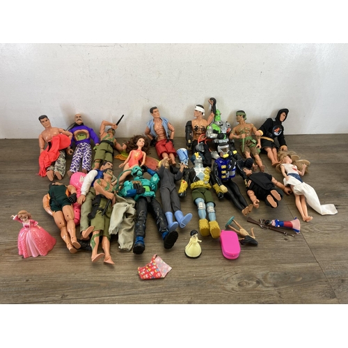 520A - A collection of Action Man, dolls and accessories to include Tempest Villain, Doctor Robot etc.