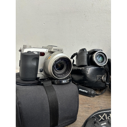 792 - A collection of digital bridge cameras to include Fujifilm FinePix S9500 9mp, Nikon CoolPix L120 14.... 