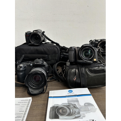 792 - A collection of digital bridge cameras to include Fujifilm FinePix S9500 9mp, Nikon CoolPix L120 14.... 