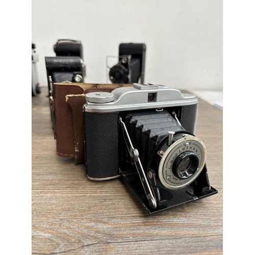 794 - Eleven folding cameras to include Zeiss Ikon Nettar 515/16, Voigtländer Bessa, Kodak Six-20 Junior m... 