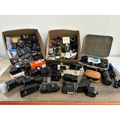 803 - Two boxes containing photography accessories to include flashes, filters, tripods, light meters, len... 