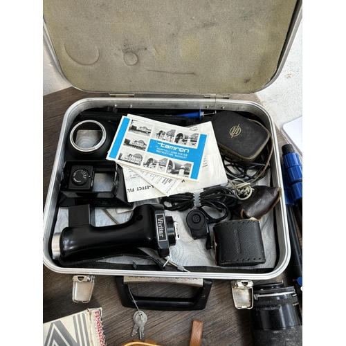 803 - Two boxes containing photography accessories to include flashes, filters, tripods, light meters, len... 