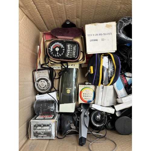 803 - Two boxes containing photography accessories to include flashes, filters, tripods, light meters, len... 