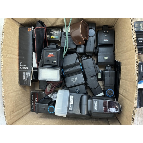 803 - Two boxes containing photography accessories to include flashes, filters, tripods, light meters, len... 