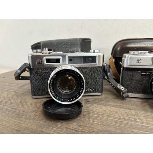 804 - Four 35mm rangefinder cameras, one Canon Canonet QL17 G-III, one cased Minolta A5, one cased Yashica... 