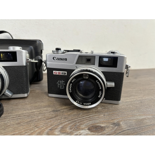 804 - Four 35mm rangefinder cameras, one Canon Canonet QL17 G-III, one cased Minolta A5, one cased Yashica... 