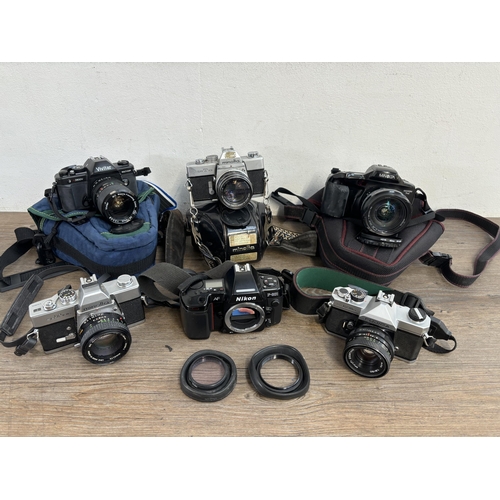 811 - Six 35mm SLR cameras to include Nikon F-801, Fujica ST605N, Minolta SRT101b etc.