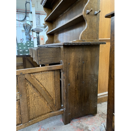 1 - A Nigel Griffiths carved oak dresser - approx. 165cm high x 167cm wide x 42cm deep