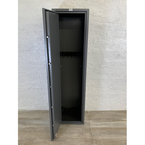 101 - A large grey metal gun cabinet - approx. 152cm high x 40cm wide x 33cm deep