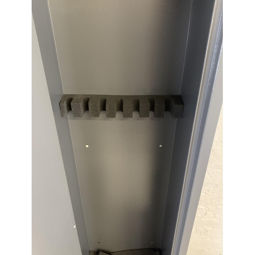 101 - A large grey metal gun cabinet - approx. 152cm high x 40cm wide x 33cm deep