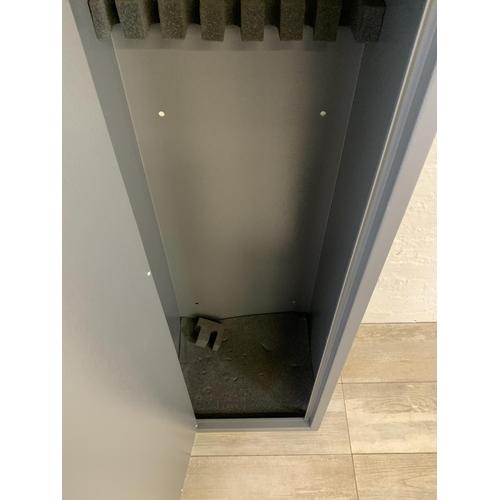 101 - A large grey metal gun cabinet - approx. 152cm high x 40cm wide x 33cm deep