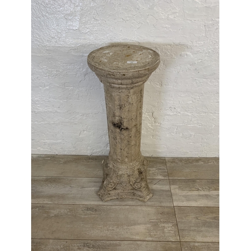 106 - A fiberglass stone effect Corinthian jardinière stand - approx. 85cm high