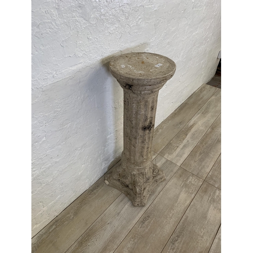 106 - A fiberglass stone effect Corinthian jardinière stand - approx. 85cm high