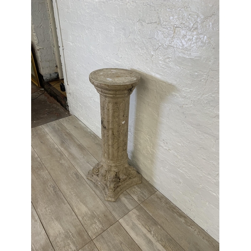 106 - A fiberglass stone effect Corinthian jardinière stand - approx. 85cm high