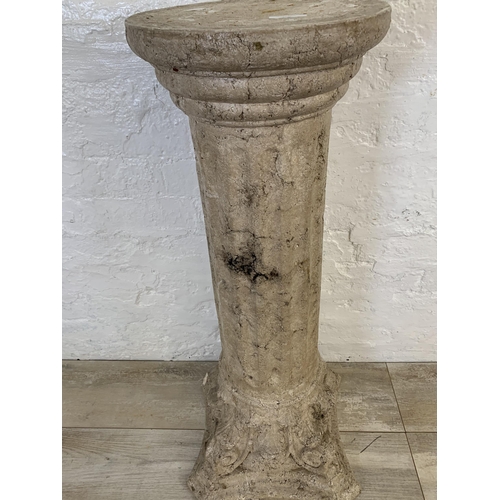 106 - A fiberglass stone effect Corinthian jardinière stand - approx. 85cm high