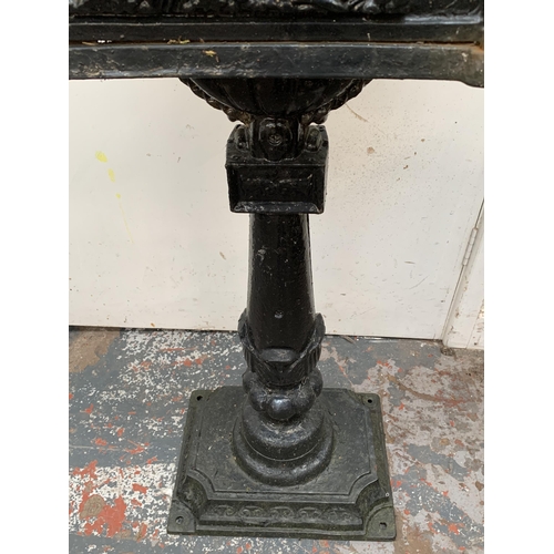 107 - A Victorian style cast iron and black painted post box on stand - approx. 117cm high