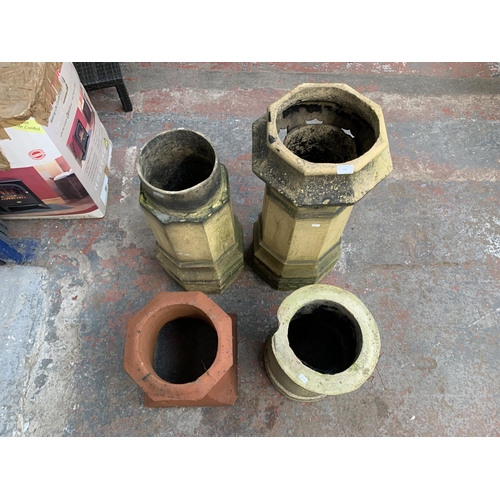 109 - Four antique chimney pots, three cast stone and one terracotta