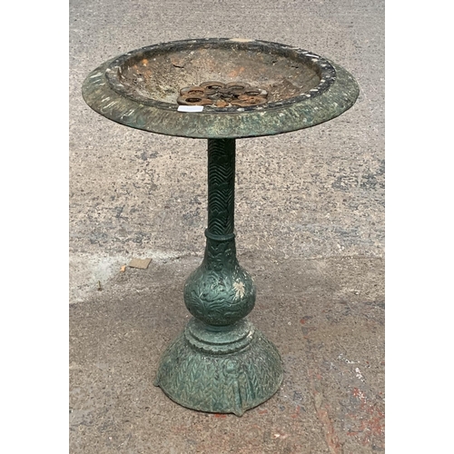 110 - A Victorian style cast iron green painted bird bath - approx. 65cm high