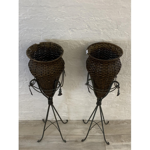 13 - A pair of French style patinated cast metal and wicker floor vases - each approx. 103cm high