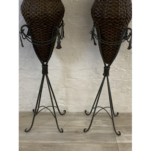 13 - A pair of French style patinated cast metal and wicker floor vases - each approx. 103cm high