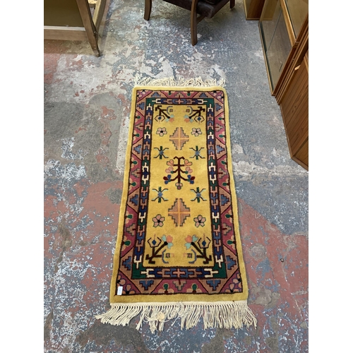 20 - Three mid/late 20th century woollen rugs