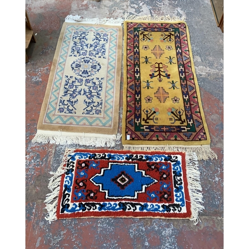 20 - Three mid/late 20th century woollen rugs