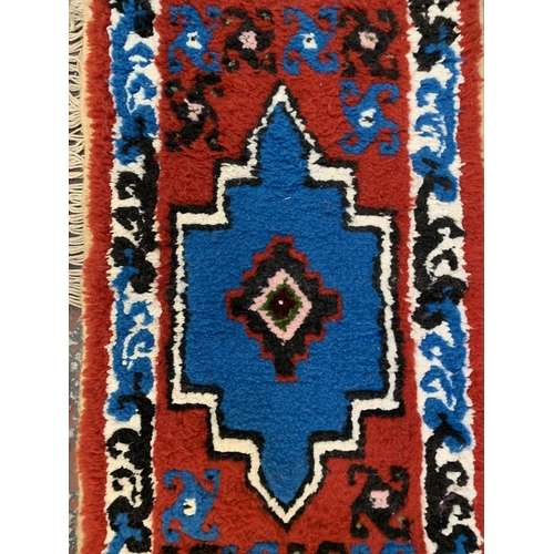 20 - Three mid/late 20th century woollen rugs