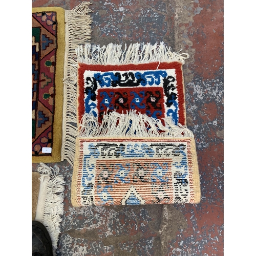 20 - Three mid/late 20th century woollen rugs