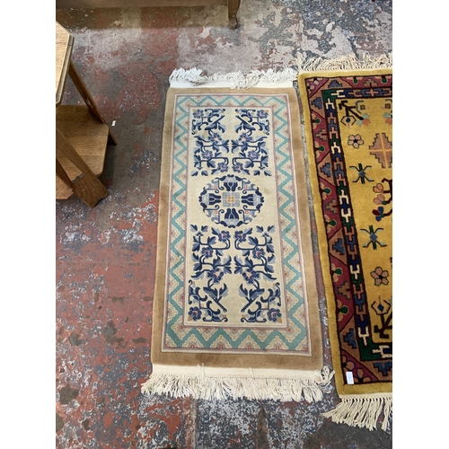 20 - Three mid/late 20th century woollen rugs