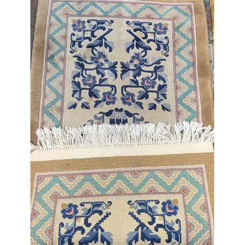 20 - Three mid/late 20th century woollen rugs