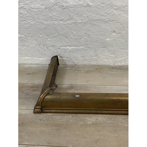 21 - A Victorian brass fire fender - approx. 129cm wide