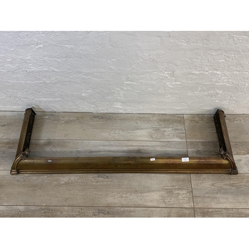 21 - A Victorian brass fire fender - approx. 129cm wide