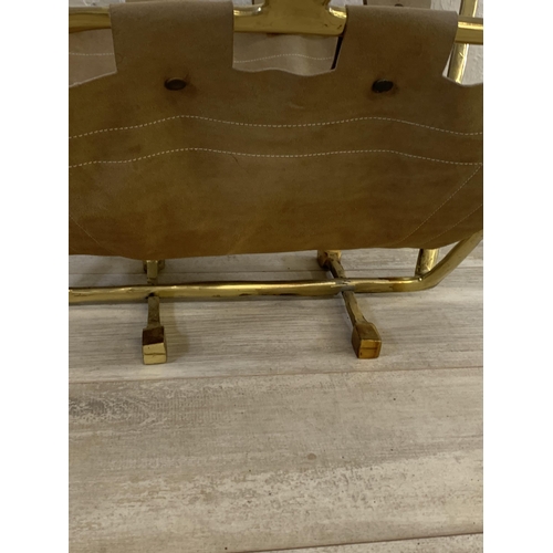 22 - A 1980s David Marshall brass and brown suede magazine rack - approx. 36cm high x 57cm long x 39cm wi... 