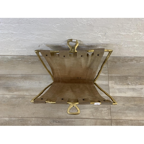 22 - A 1980s David Marshall brass and brown suede magazine rack - approx. 36cm high x 57cm long x 39cm wi... 