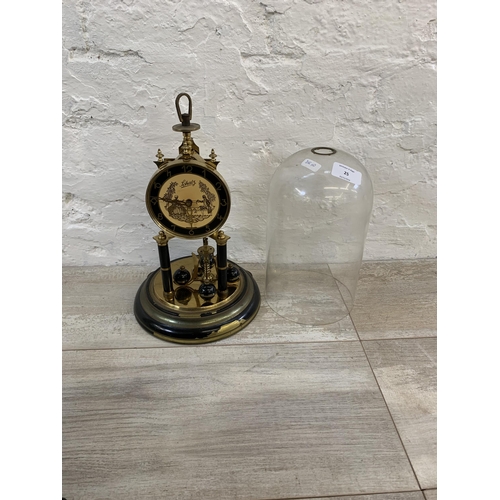 25 - A vintage German Schatz brass and glass anniversary mantel clock - approx. 32cm high