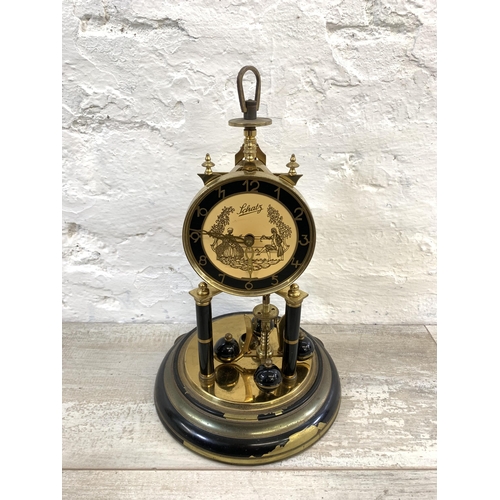 25 - A vintage German Schatz brass and glass anniversary mantel clock - approx. 32cm high