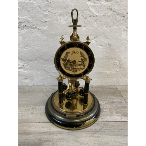 25 - A vintage German Schatz brass and glass anniversary mantel clock - approx. 32cm high