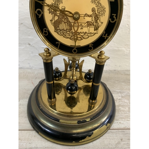 25 - A vintage German Schatz brass and glass anniversary mantel clock - approx. 32cm high