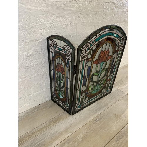 26 - An Arts & Crafts style stained glass three section fire screen - approx. 71cm high x 107cm wide