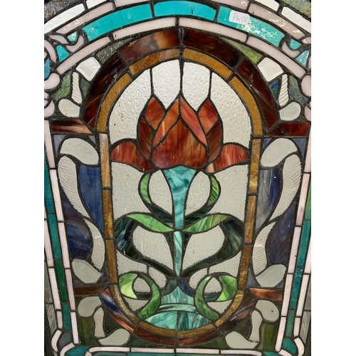 26 - An Arts & Crafts style stained glass three section fire screen - approx. 71cm high x 107cm wide