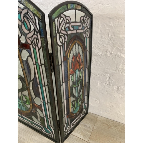 26 - An Arts & Crafts style stained glass three section fire screen - approx. 71cm high x 107cm wide