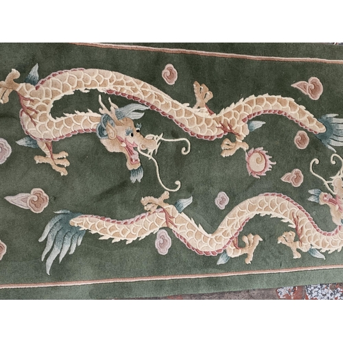 27 - Two vintage Chinese woollen rugs - largest approx. 198cm long x 93cm wide