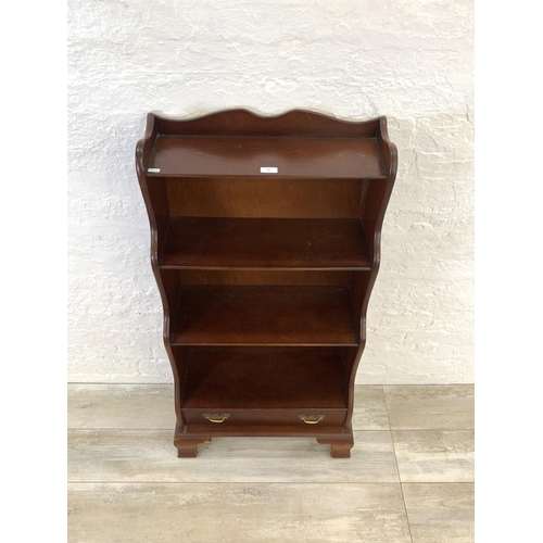 29 - A J. Sydney Smith mahogany waterfall free-standing bookcase - approx. 113cm high x 57cm wide