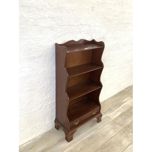 29 - A J. Sydney Smith mahogany waterfall free-standing bookcase - approx. 113cm high x 57cm wide