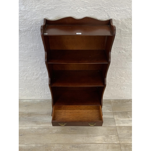 29 - A J. Sydney Smith mahogany waterfall free-standing bookcase - approx. 113cm high x 57cm wide