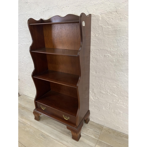 29 - A J. Sydney Smith mahogany waterfall free-standing bookcase - approx. 113cm high x 57cm wide