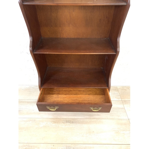 29 - A J. Sydney Smith mahogany waterfall free-standing bookcase - approx. 113cm high x 57cm wide