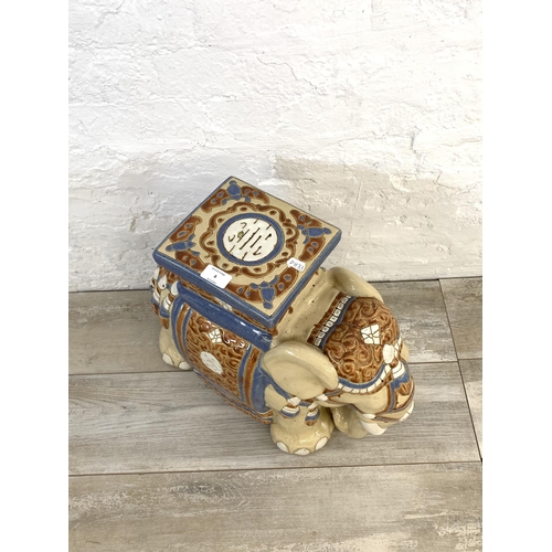 4 - A ceramic elephant jardinière stand/side table - approx. 44cm high